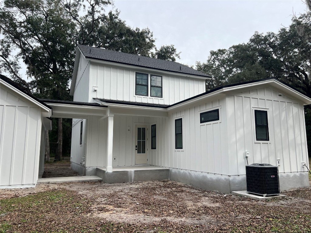 766 Adams Road Fernandina Beach, FL 32034 - Photo 3 of 31 a front view of a house with a yard