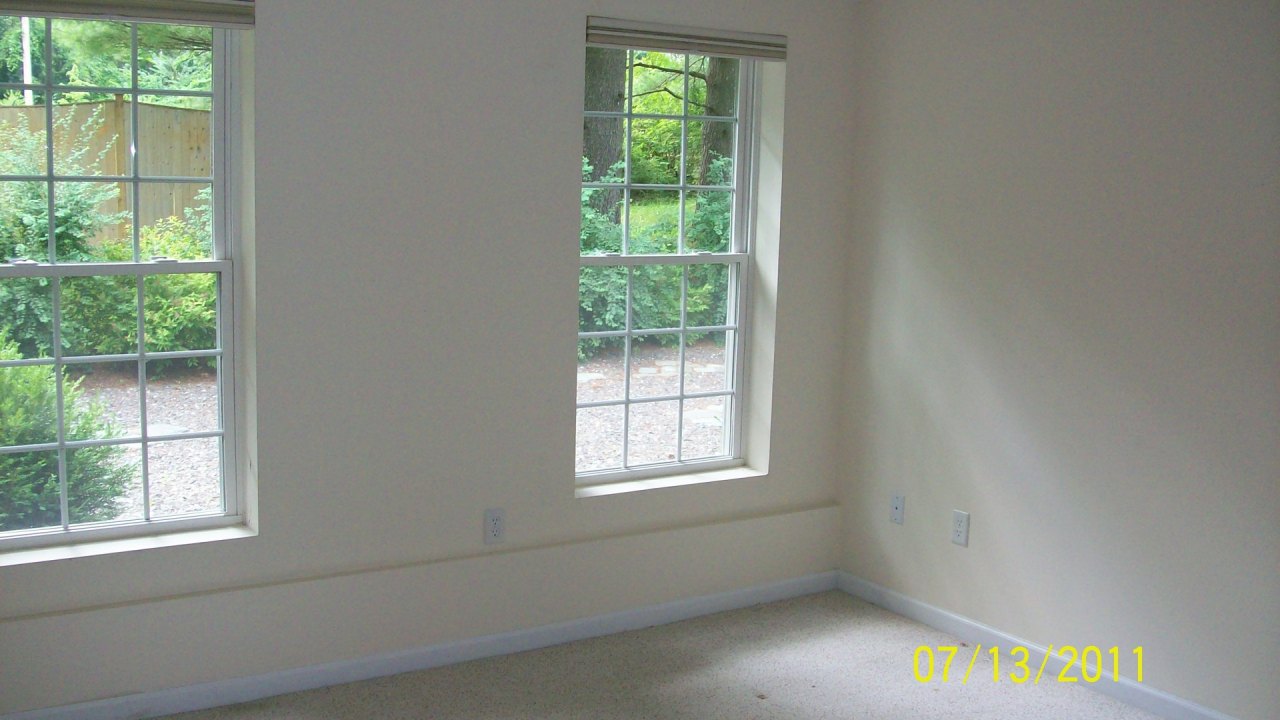 72 Interlaken Road, Unit 3 West Stockbridge, MA 01266 - Photo 6 of 10 a view of an empty room with a window