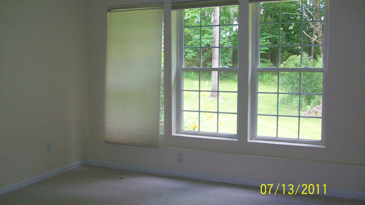 72 Interlaken Road, Unit 3 West Stockbridge, MA 01266 - Photo 7 of 10 an empty room with a window