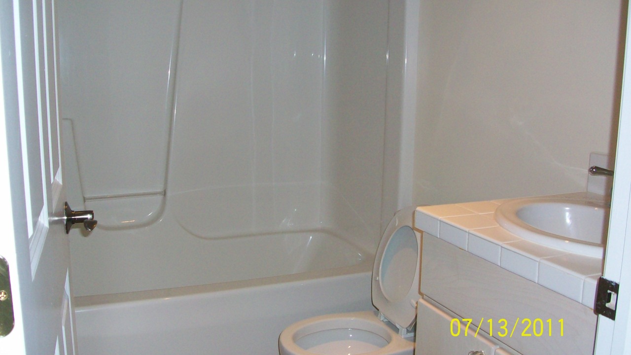 72 Interlaken Road, Unit 3 West Stockbridge, MA 01266 - Photo 10 of 10 a bathroom with a sink a toilet and bathtub