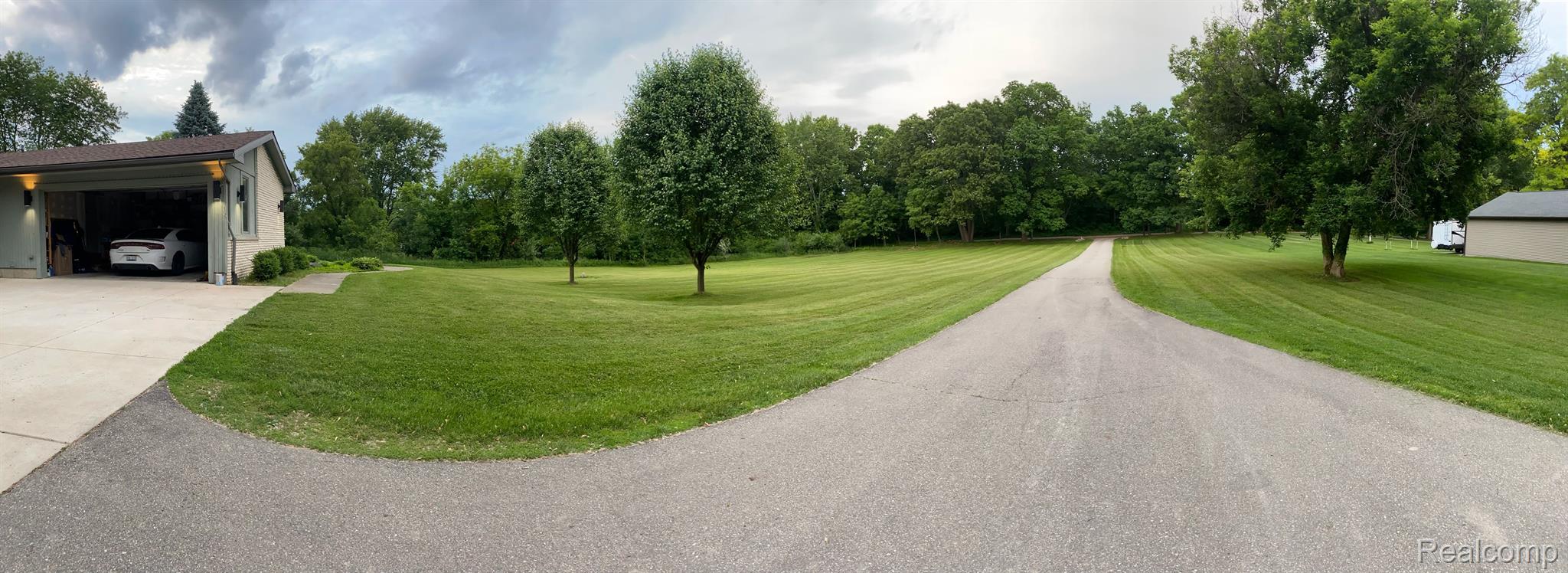 3856 Beattie Road Howell, MI 48843 - Photo 1 of 3 Garage, Driveway and Front Yard