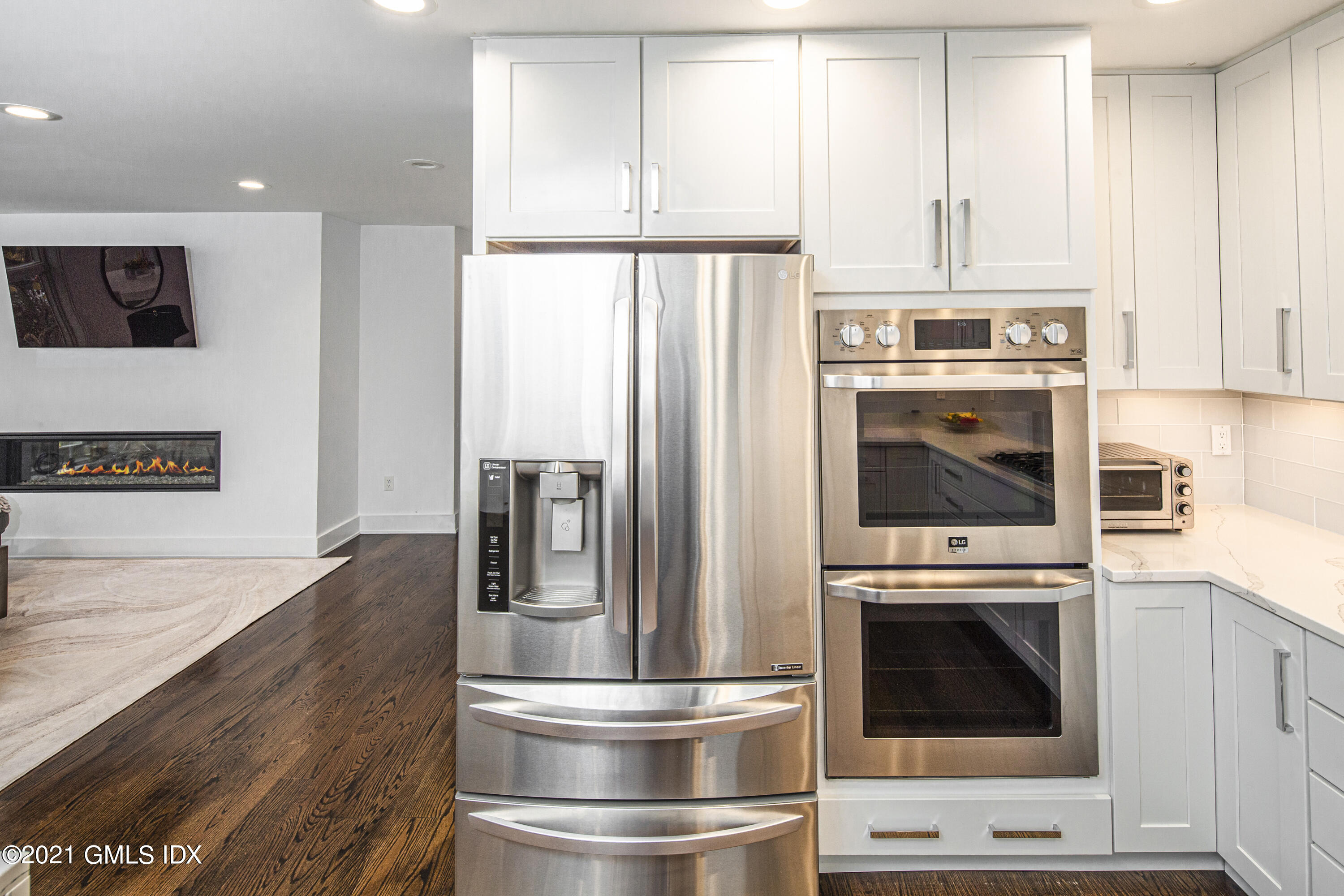 19 Ritch Avenue Greenwich, CT 06830 - Photo 11 of 29 a kitchen with a refrigerator and a stove