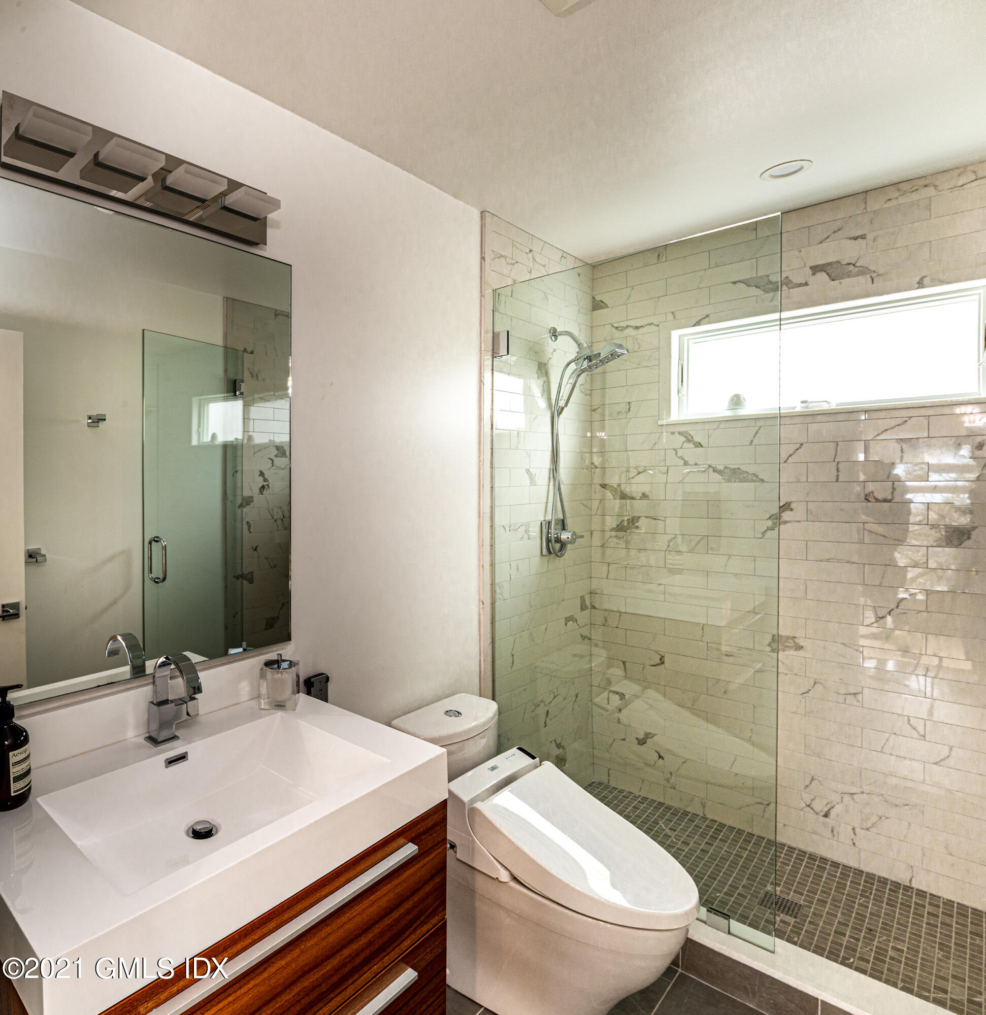 19 Ritch Avenue Greenwich, CT 06830 - Photo 13 of 29 a bathroom with a sink toilet and shower