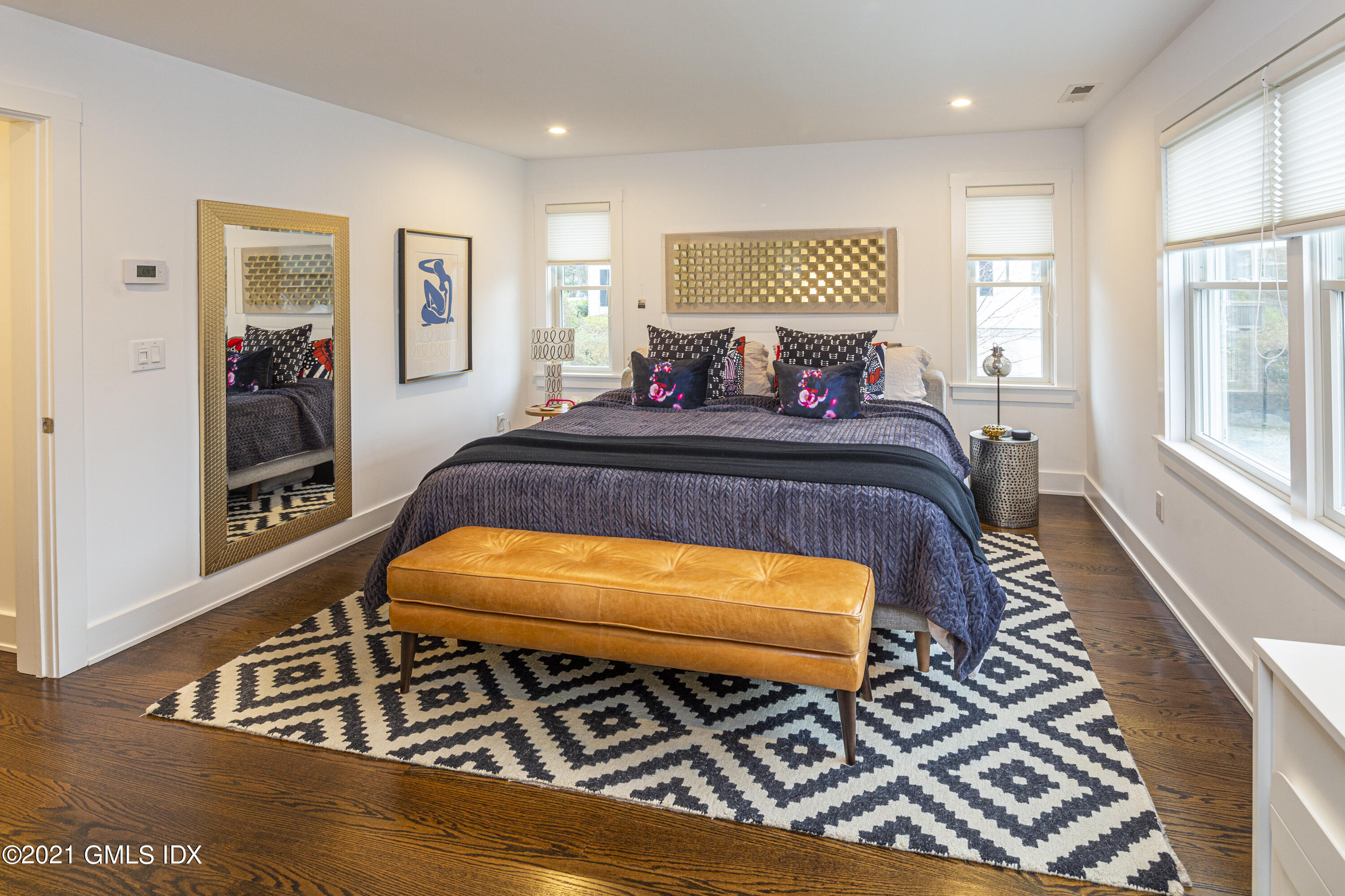 19 Ritch Avenue Greenwich, CT 06830 - Photo 14 of 29 a bed sitting in a bedroom next to a window