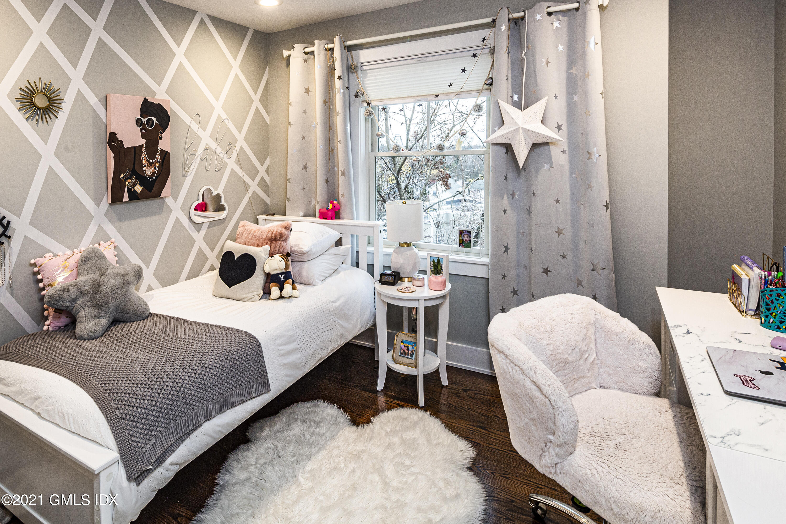 19 Ritch Avenue Greenwich, CT 06830 - Photo 19 of 29 a bedroom with a bed and a chandelier