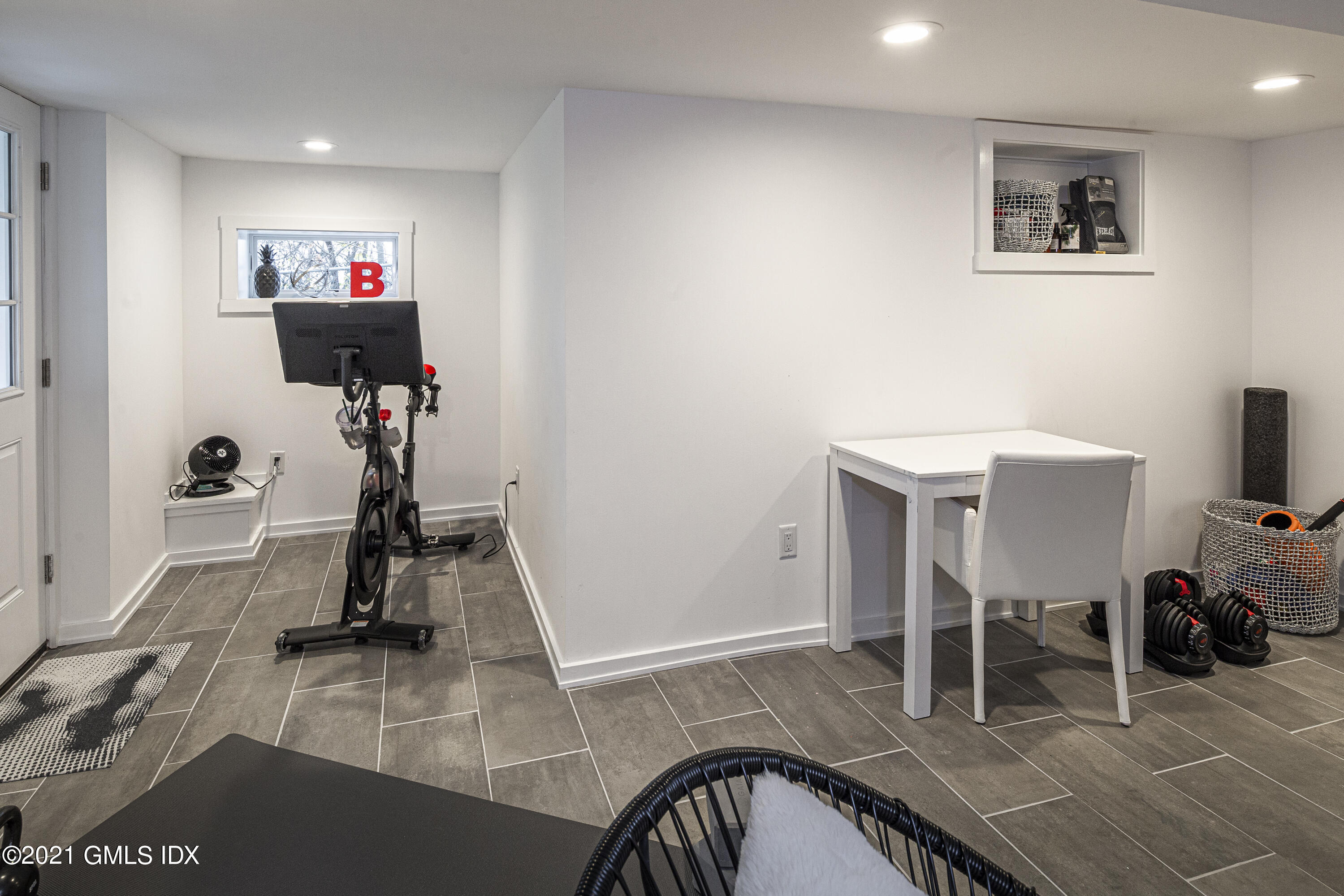 19 Ritch Avenue Greenwich, CT 06830 - Photo 25 of 29 a view of a livingroom with furniture and gym equipment