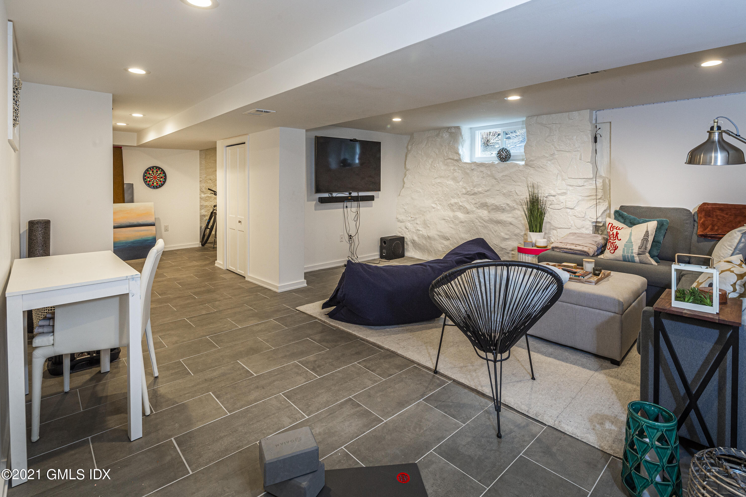 19 Ritch Avenue Greenwich, CT 06830 - Photo 26 of 29 a living room with furniture and a flat screen tv