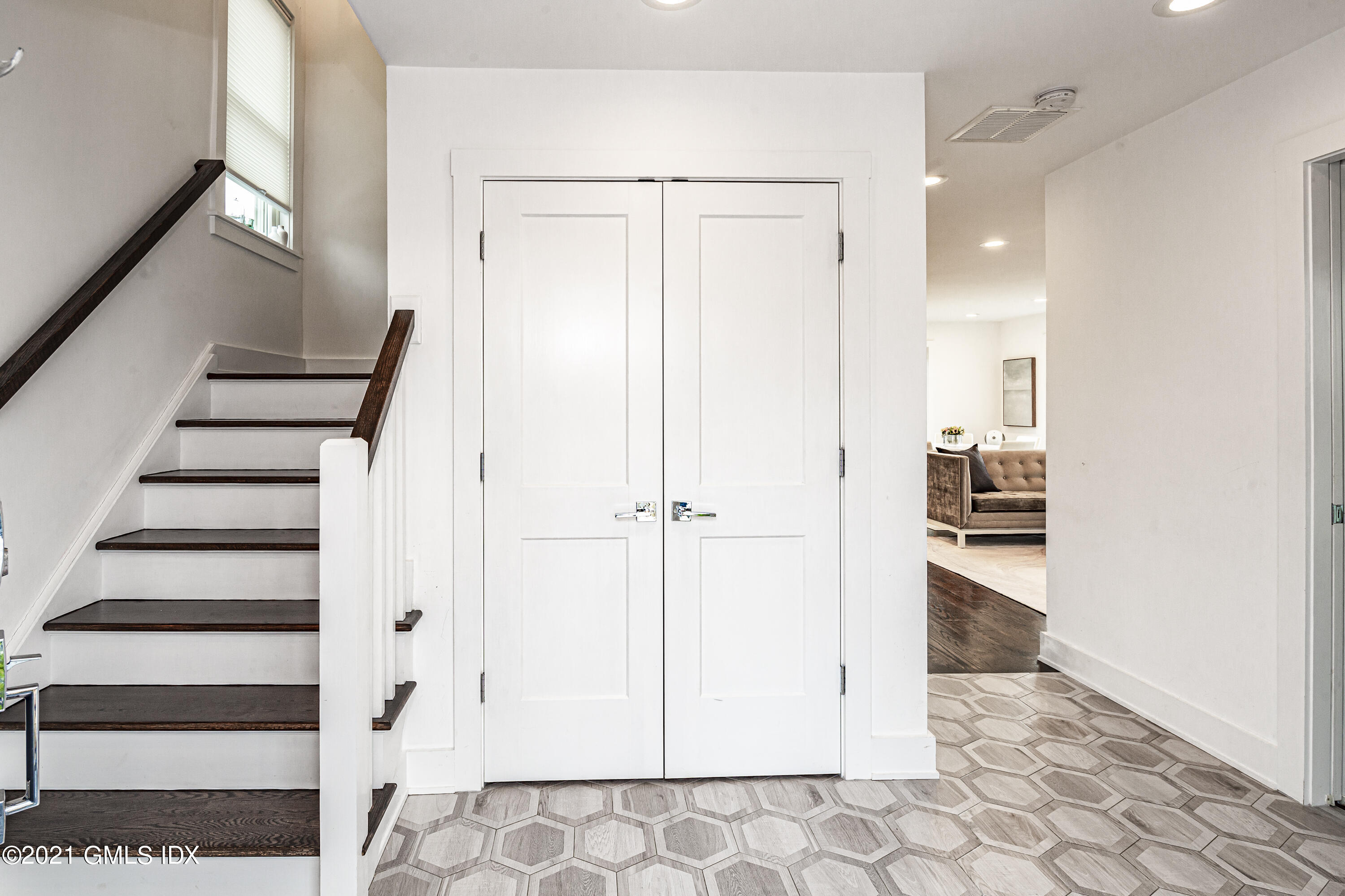 19 Ritch Avenue Greenwich, CT 06830 - Photo 6 of 29 a view of a hallway with wooden floor and staircase