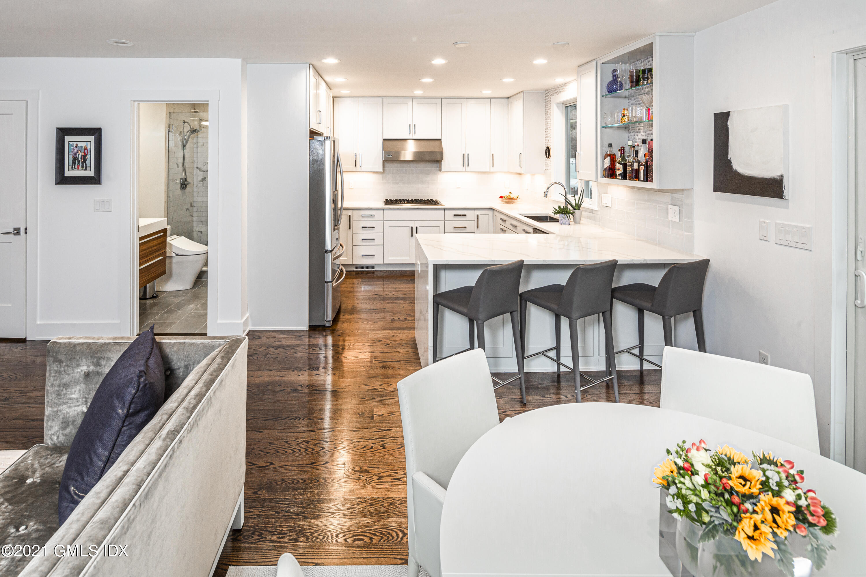 19 Ritch Avenue Greenwich, CT 06830 - Photo 8 of 29 a living room with stainless steel appliances kitchen island granite countertop a dining table and chairs