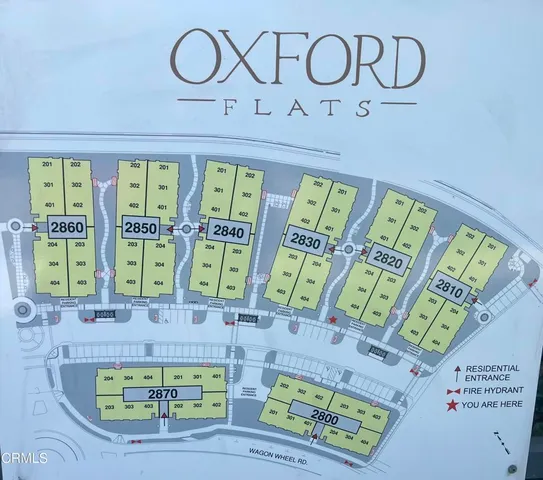 a front view of a multi story residential apartment building with stainless steel appliances