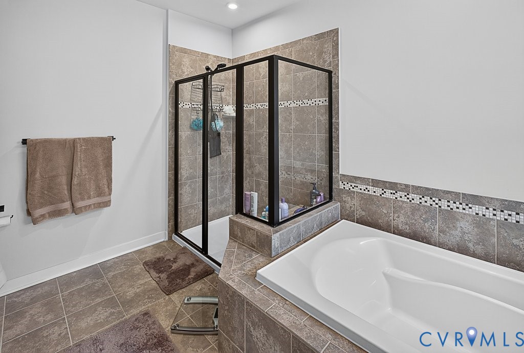 17976 Spotted Oak Road Dumfries, VA 22026 - Photo 38 of 52 Bathroom featuring a built-in soaking tub, a stand