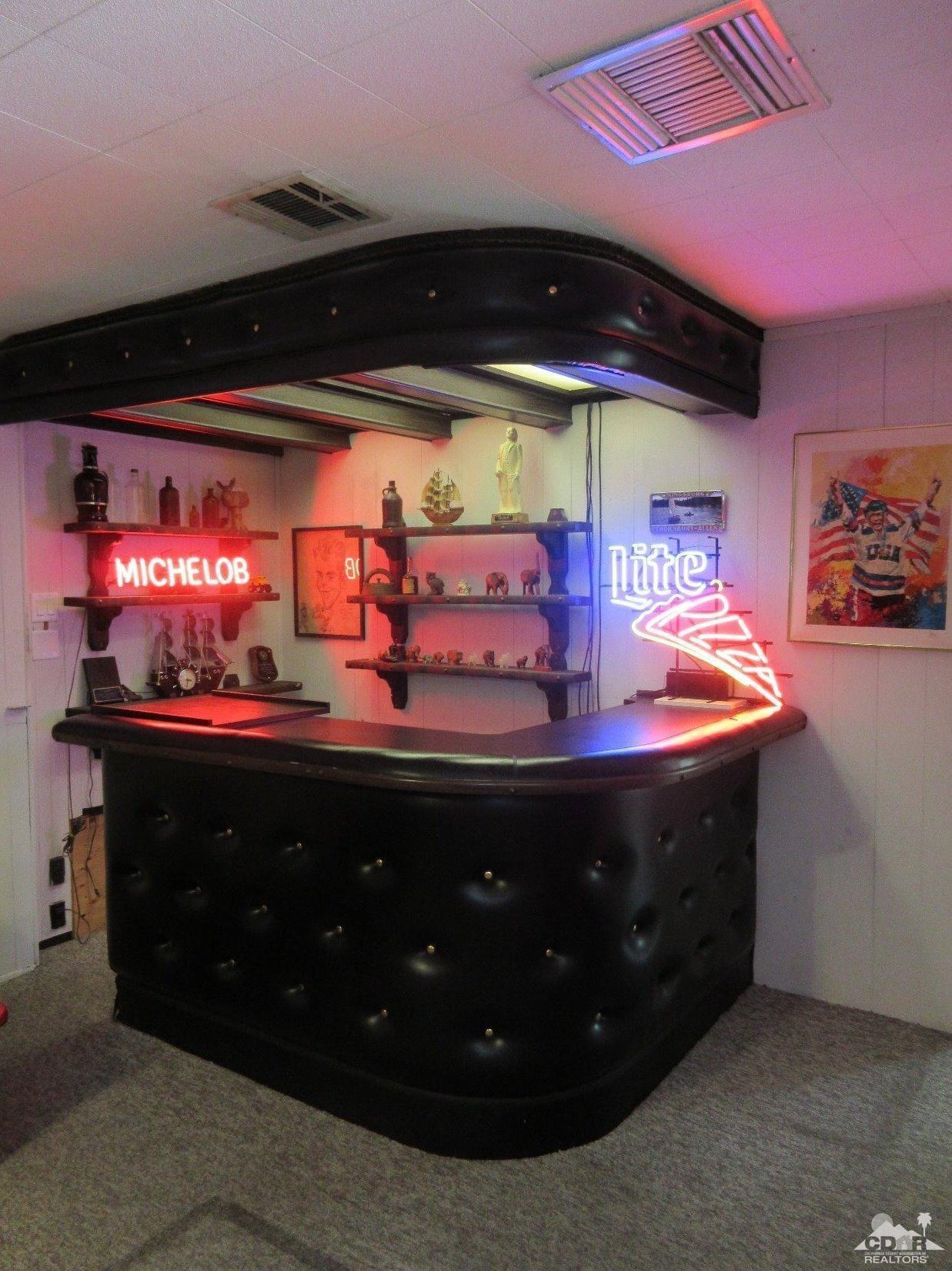 36915 Palmdale Road Rancho Mirage, CA 92270 - Photo 13 of 23 a room with lots of counter top space and a ceiling fan