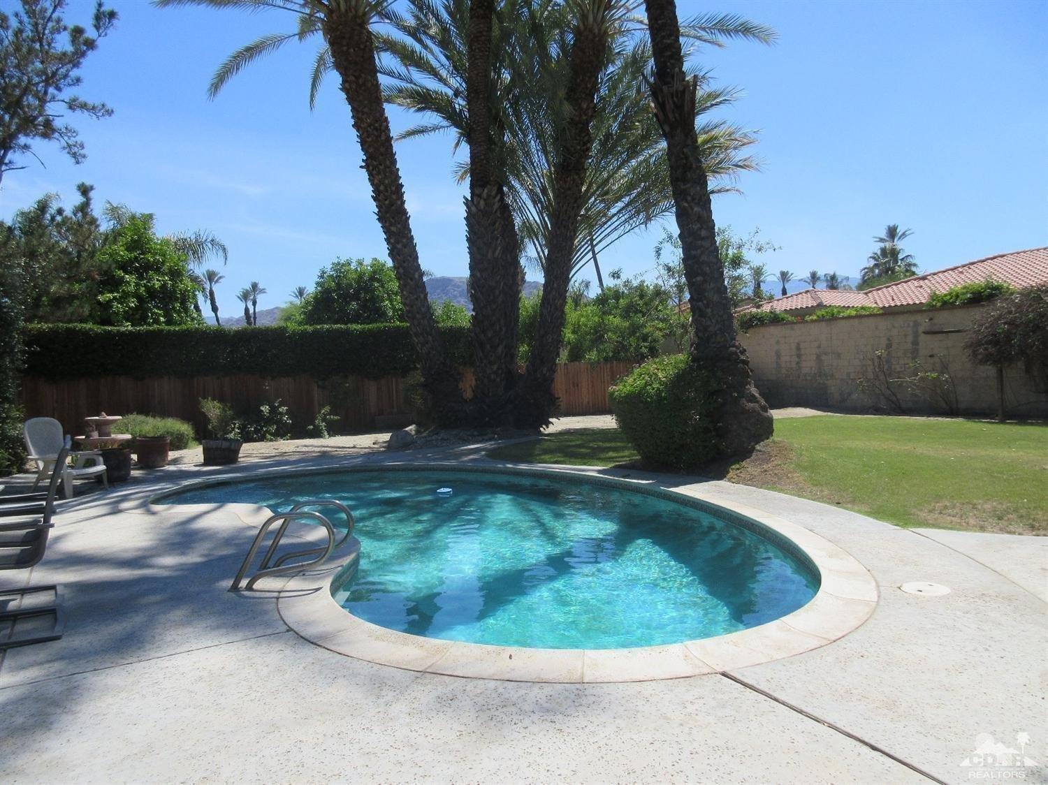 36915 Palmdale Road Rancho Mirage, CA 92270 - Photo 18 of 23 a view of a backyard with a tub and trees