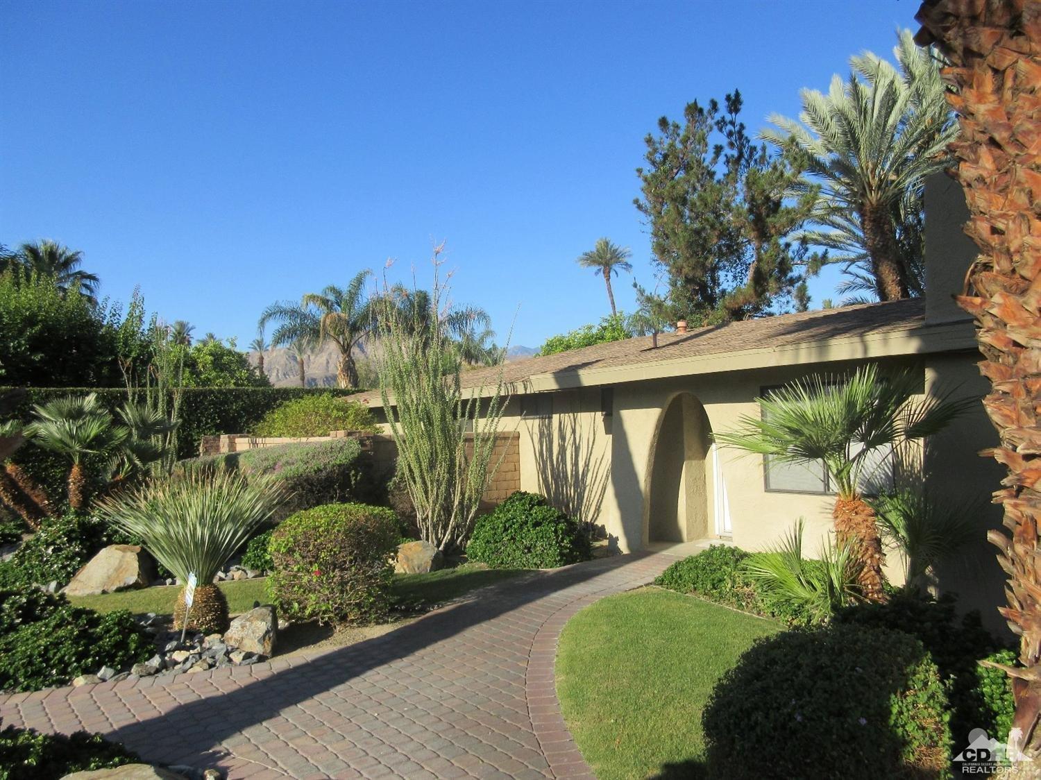 36915 Palmdale Road Rancho Mirage, CA 92270 - Photo 2 of 23 a view of a backyard with plants