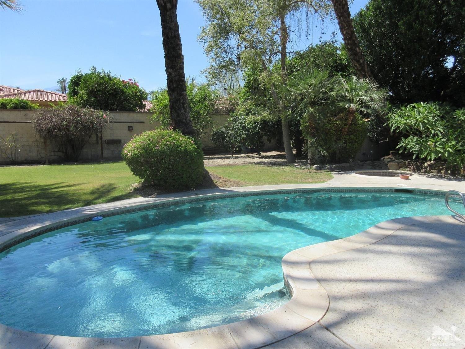 36915 Palmdale Road Rancho Mirage, CA 92270 - Photo 22 of 23 a view of a backyard with swimming pool