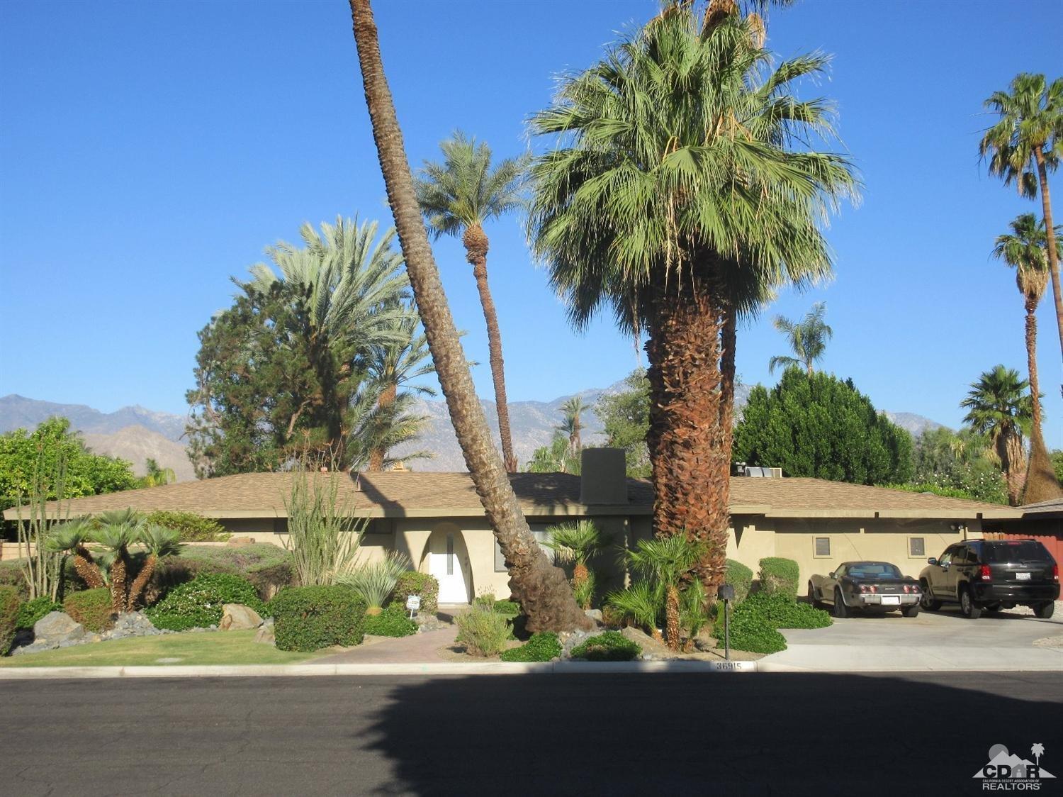 36915 Palmdale Road Rancho Mirage, CA 92270 - Photo 3 of 23 a view of a street with a cars parked on the road