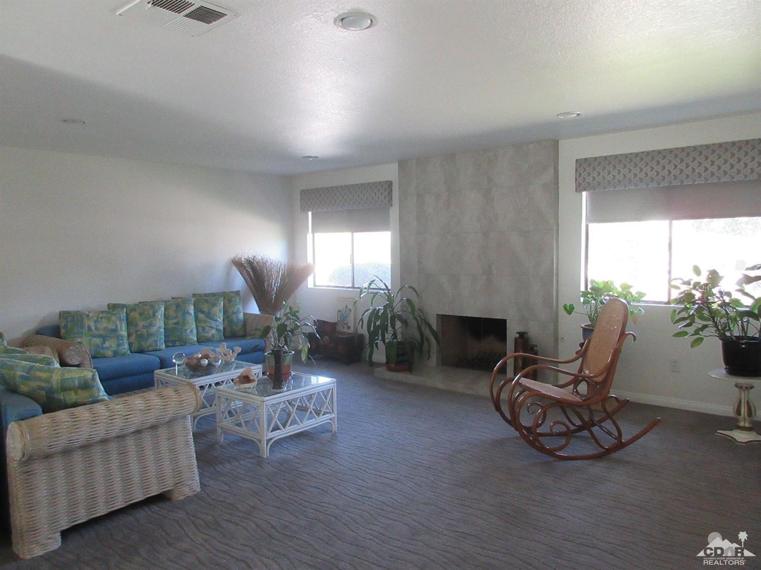 36915 Palmdale Road Rancho Mirage, CA 92270 - Photo 6 of 23 a living room with furniture and wooden floor