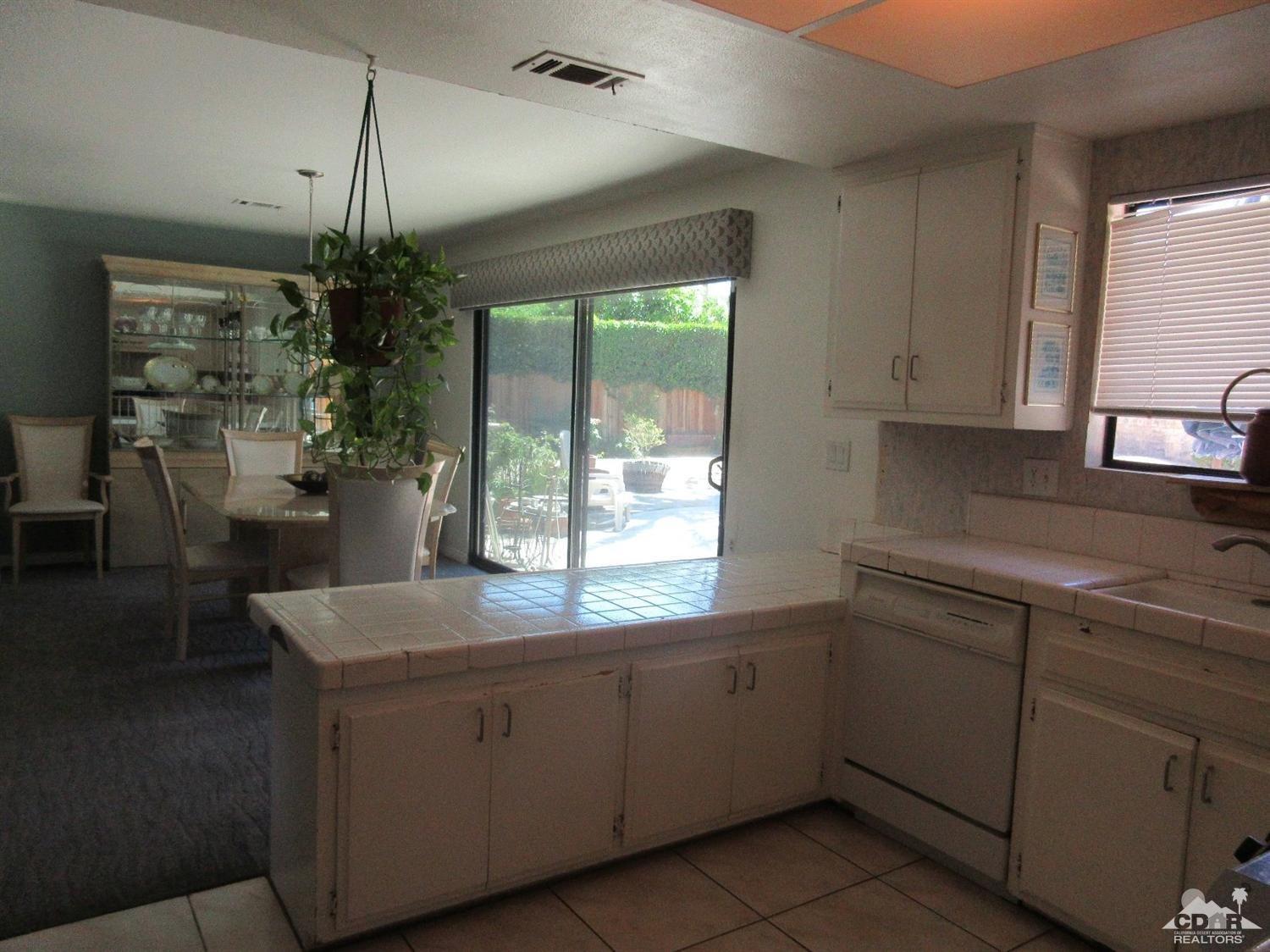 36915 Palmdale Road Rancho Mirage, CA 92270 - Photo 10 of 23 a kitchen with a sink and cabinets