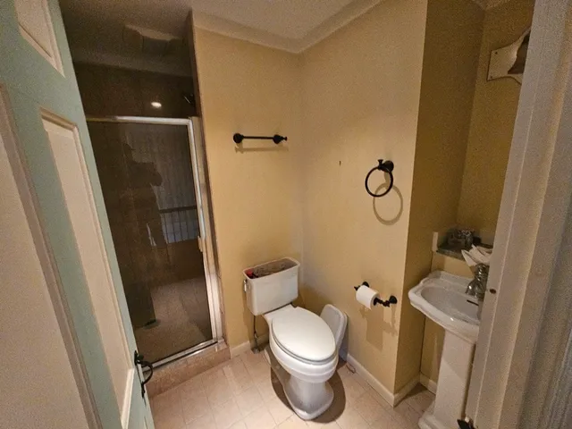 a bedroom with a bed and a fireplace