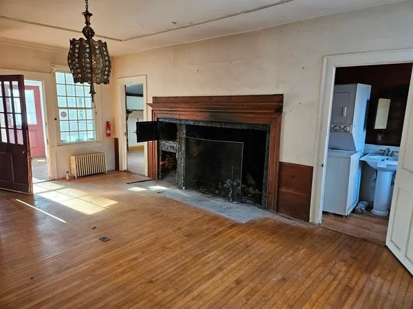 a bedroom with furniture and a fireplace