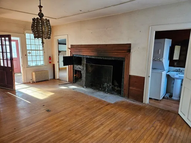 a bedroom with furniture and a fireplace