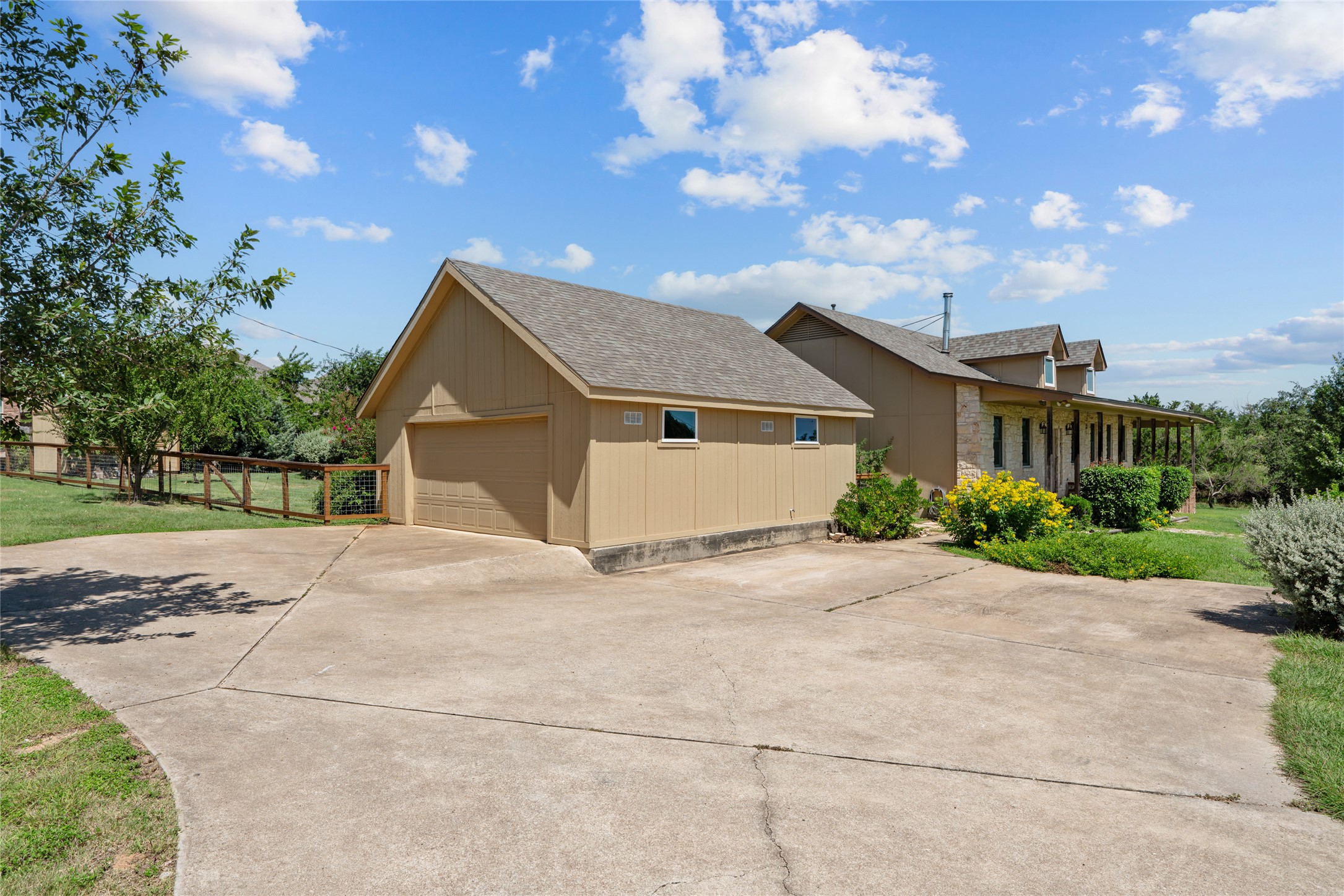 221 Chaparral Road Georgetown, TX 78628 - Photo 2 of 28 Side entry garage with turnaround parking space