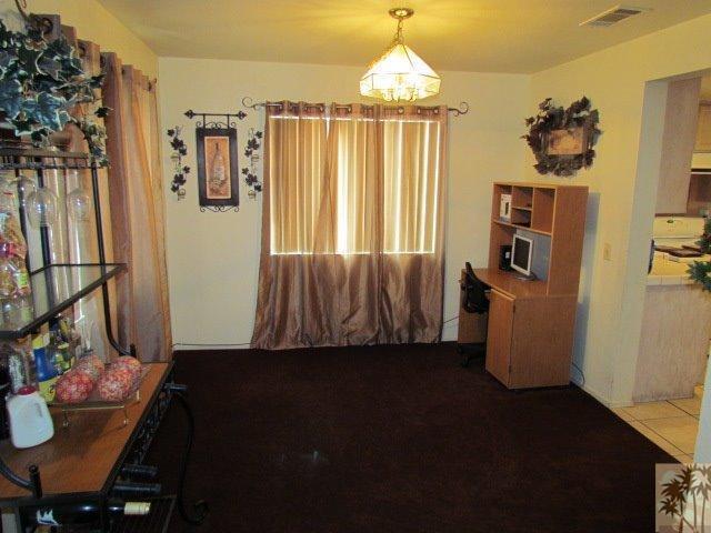 45880 Sutter Creek Road Indio, CA 92201 - Photo 12 of 42 a view of a livingroom with furniture window and wooden floor