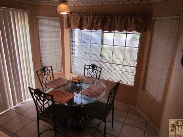 45880 Sutter Creek Road Indio, CA 92201 - Photo 18 of 42 a view of a dining room with furniture and window
