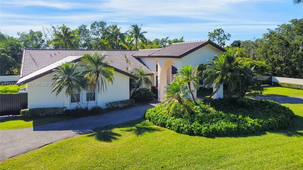 a view of a swimming pool with a garden