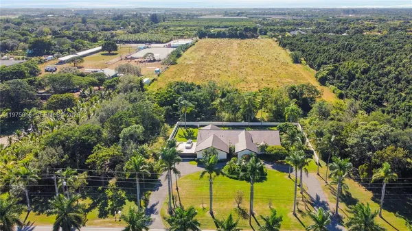 an aerial view of a house with a swimming pool