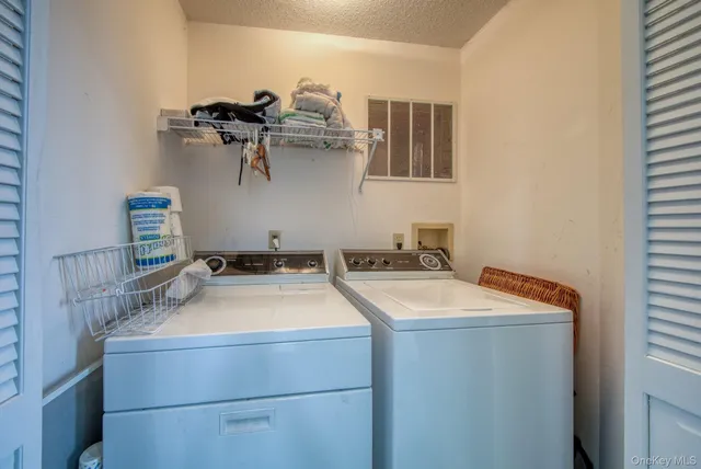 a room with a sink and mirror