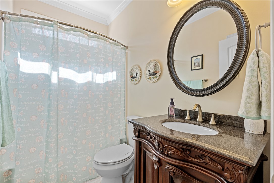 119 Turnberry Road Anderson, SC 29621 - Photo 22 of 50 This bathroom features a sophisticated vanity with ample counter space and a classic oval mirror.