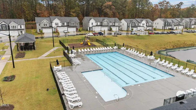 an aerial view of a house with yard