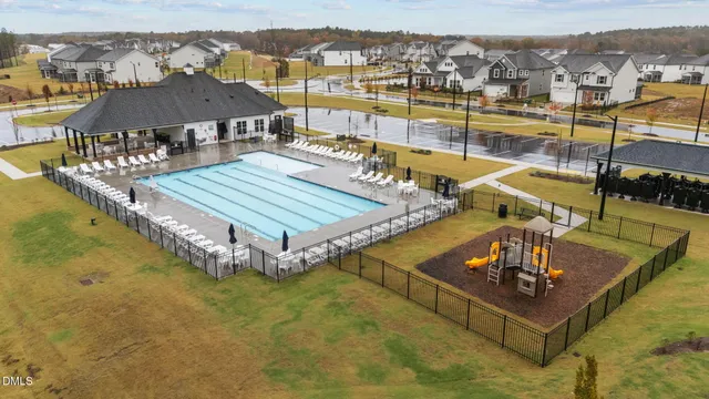 a view of a swimming pool with seating area