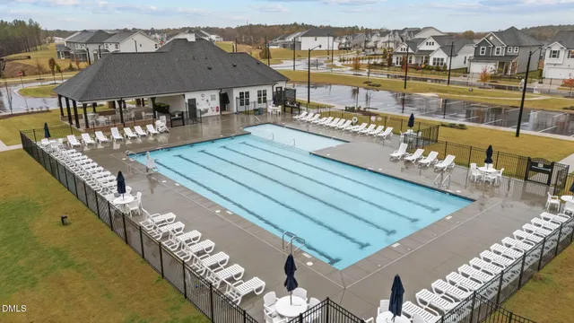 a view of a swimming pool with a lounge chairs
