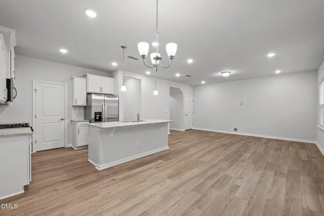 a view of kitchen with sink and microwave