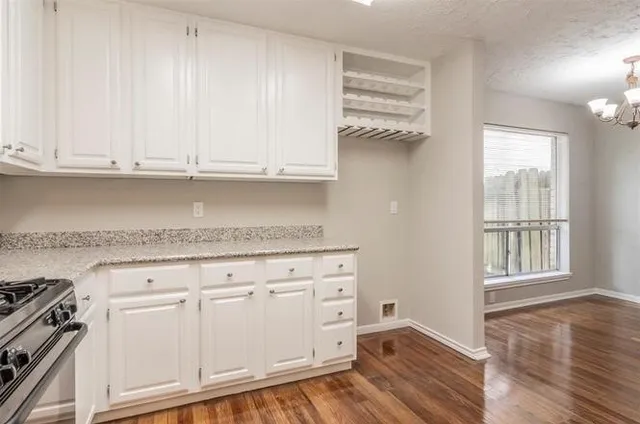 a bathroom with double sink and a mirror