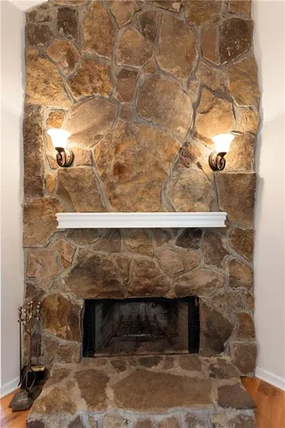 a large kitchen with granite countertop a sink and a stove