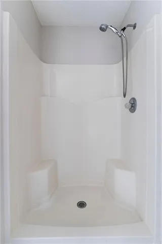 a bathroom with a bathtub and window