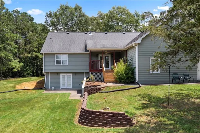 a view of a house with a yard patio and a yard