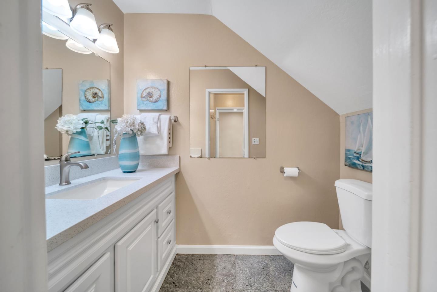 1433 Big Basin Drive Milpitas, CA 95035 - Photo 14 of 23 a bathroom with a granite countertop sink mirror vanity and toilet