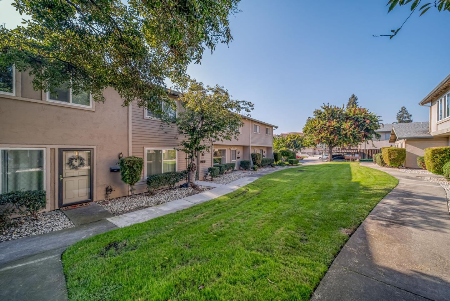 1433 Big Basin Drive Milpitas, CA 95035 - Photo 3 of 23 a front view of a house with a garden and plants
