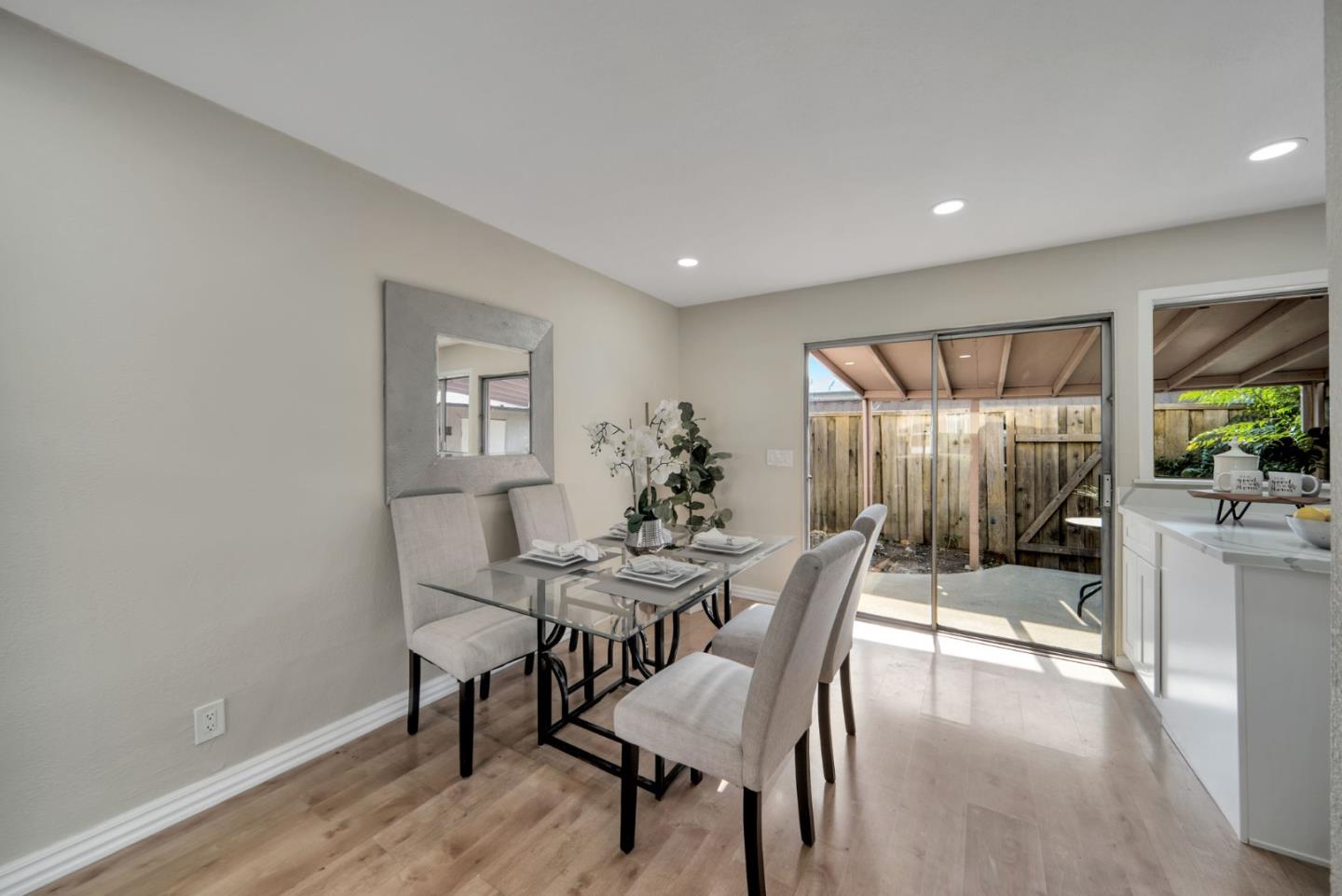 1433 Big Basin Drive Milpitas, CA 95035 - Photo 9 of 23 a view of a dining room with furniture and a potted plant