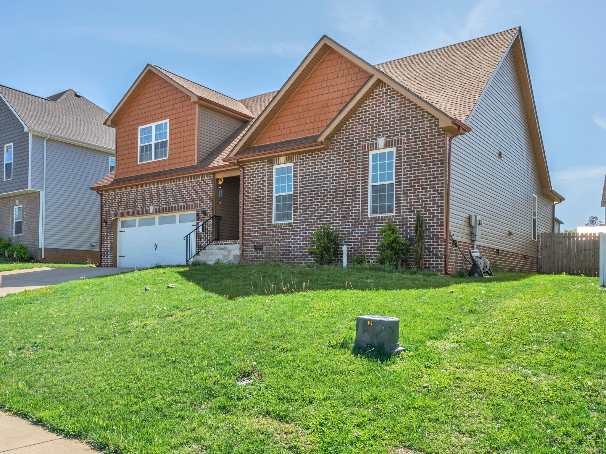 1084 Harrison Way Clarksville, TN 37042 - Photo 2 of 31 a front view of a house with a yard and a garage