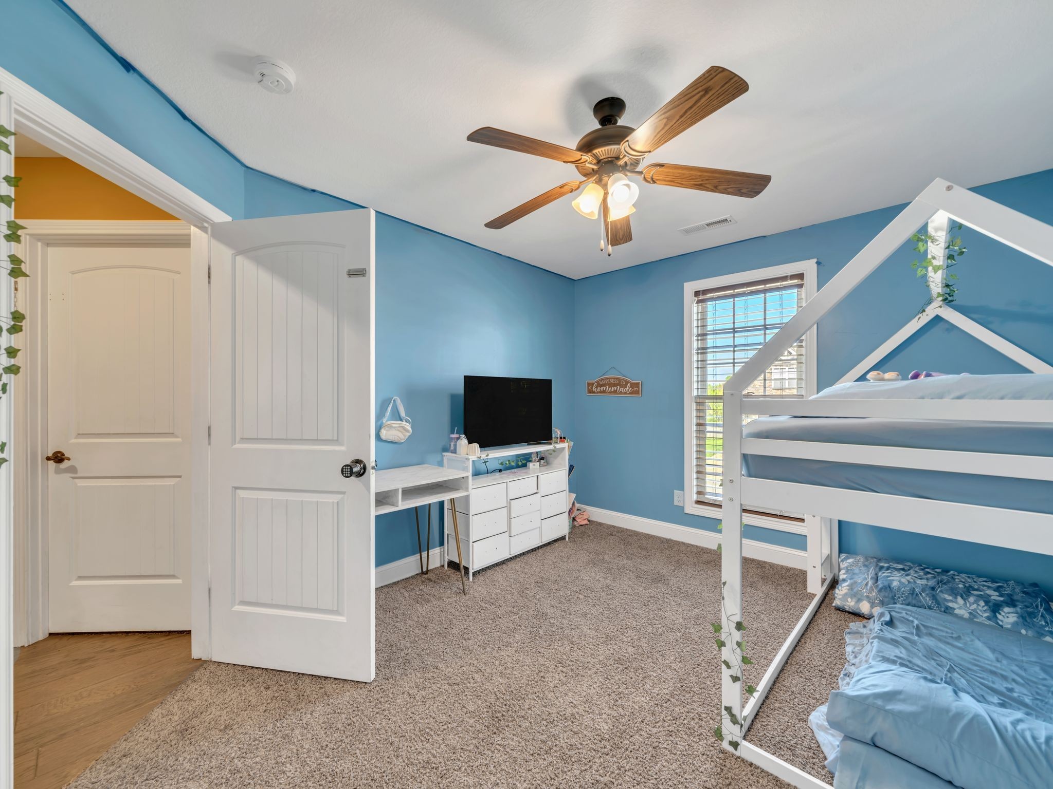 1084 Harrison Way Clarksville, TN 37042 - Photo 25 of 31 a living room with furniture and a flat screen tv