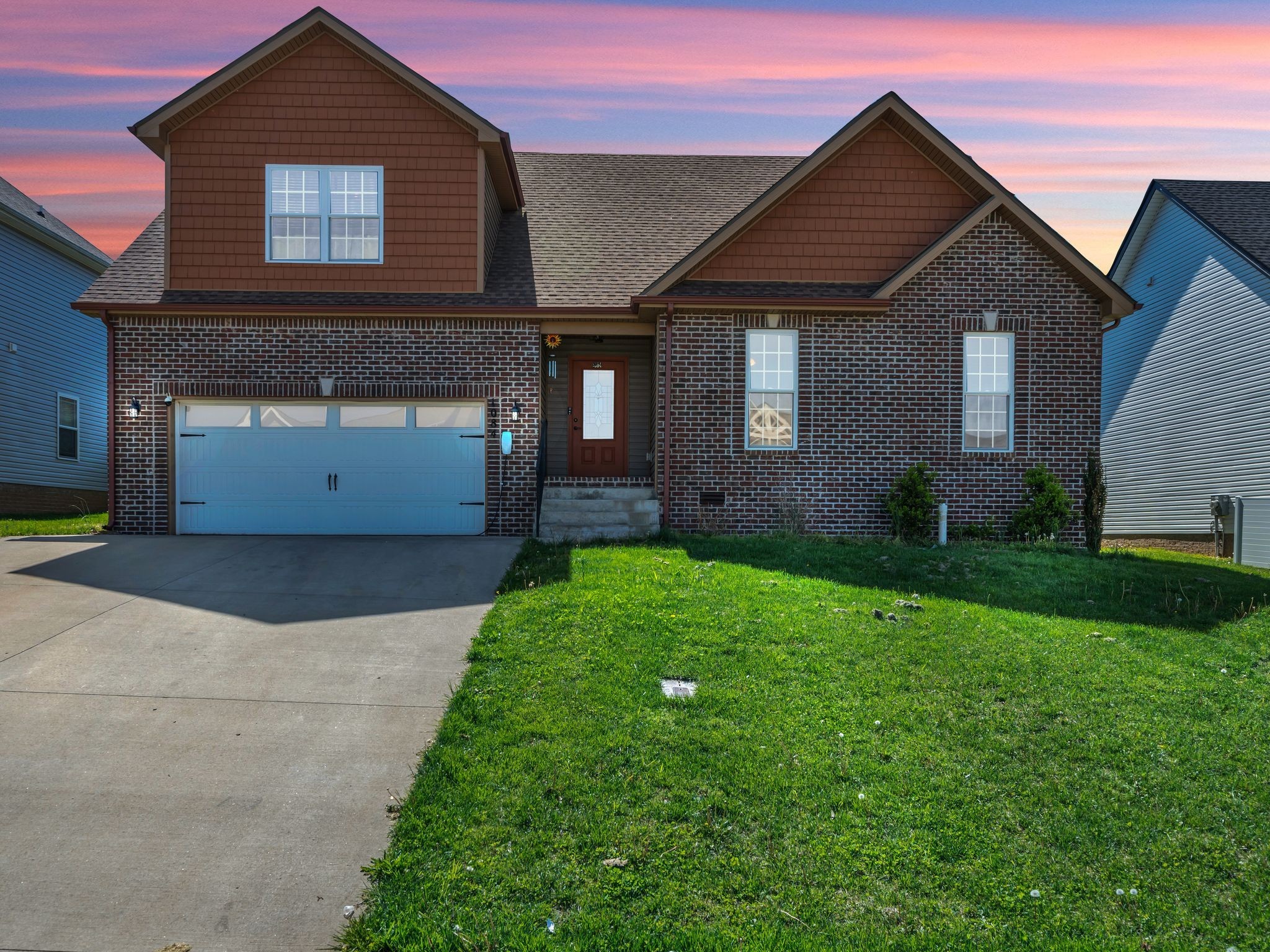 1084 Harrison Way Clarksville, TN 37042 - Photo 30 of 31 a front view of a house with a yard and garage