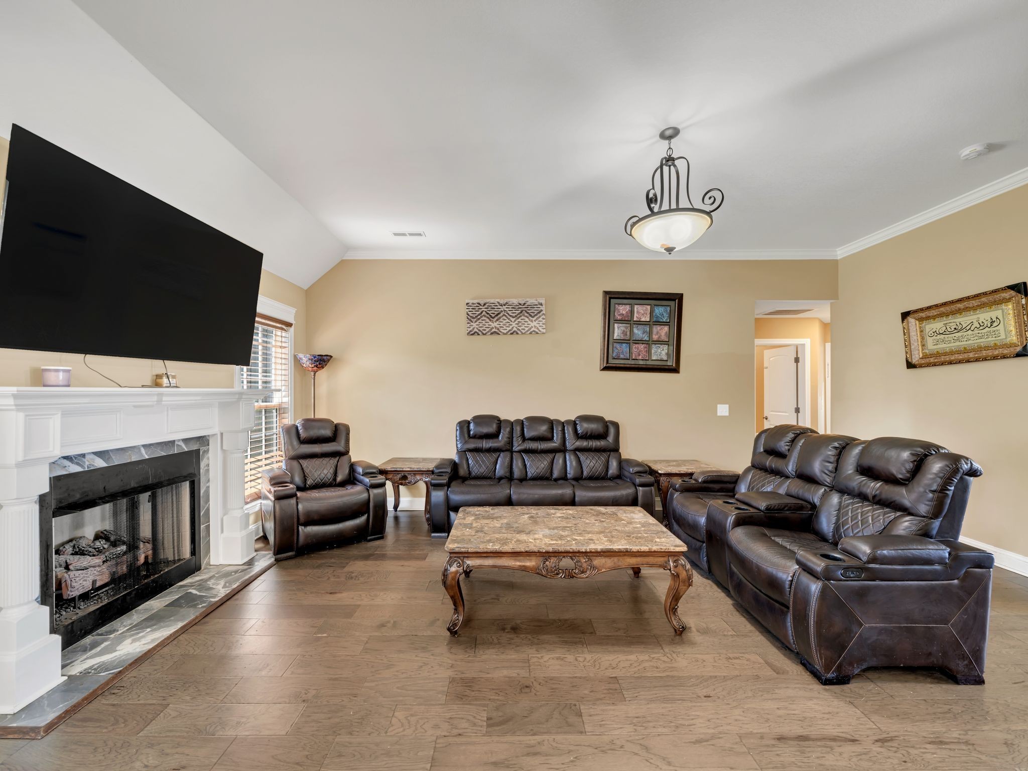 1084 Harrison Way Clarksville, TN 37042 - Photo 6 of 31 a living room with furniture a fireplace and a flat screen tv