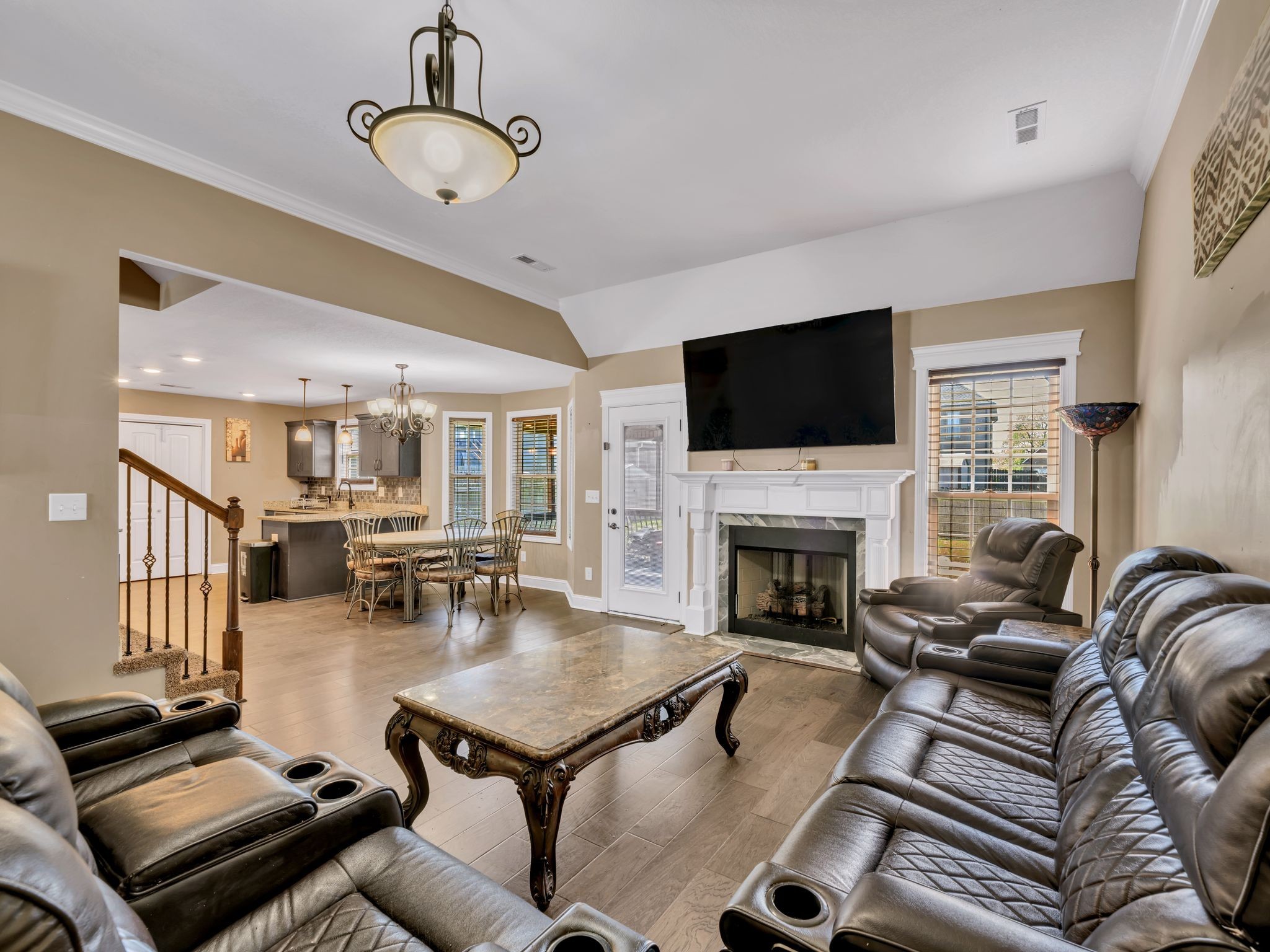 1084 Harrison Way Clarksville, TN 37042 - Photo 8 of 31 a living room with furniture a fireplace and a flat screen tv