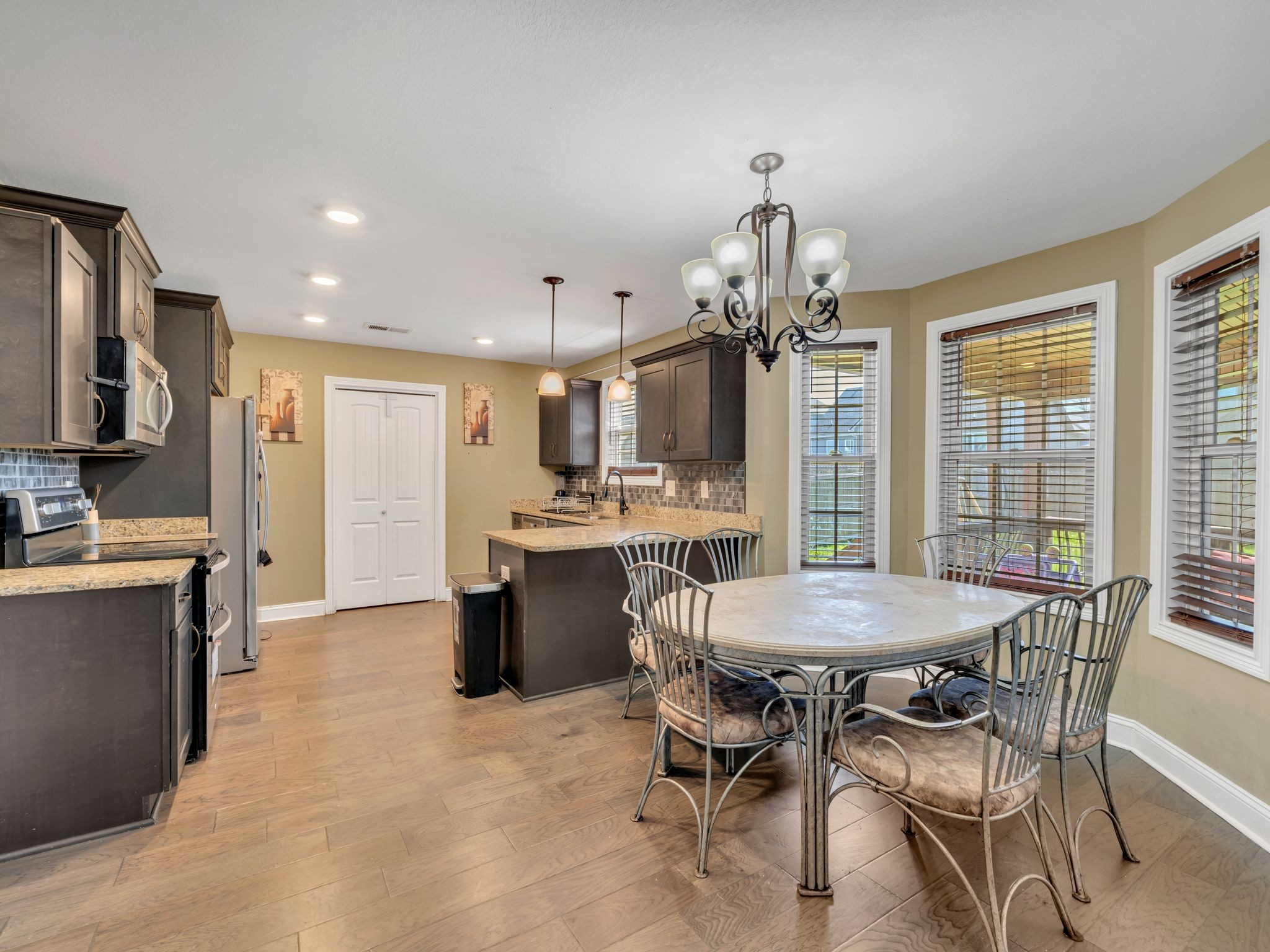 1084 Harrison Way Clarksville, TN 37042 - Photo 9 of 31 a large kitchen with a table and chairs