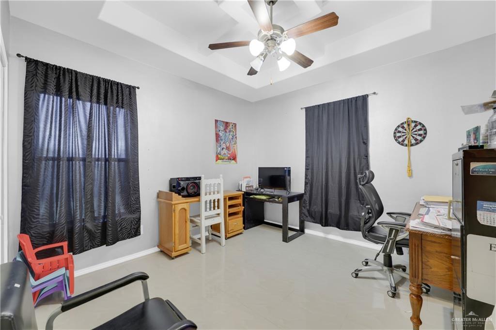 715 North Gonzalez Road Weslaco, TX 78596 - Photo 17 of 31 a view of a workspace with furniture and a window